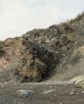 Image of a section of the cliffs/ rocks at Carylon Bay on the Coast of Cornwall, UK.