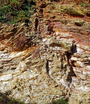 Image of a section of the cliffs at Carlyon Bay on the Coast of Cornwall, UK.  Shows the structure and Geology of these 300/400 million year old mudstone and siltstone sedimentary rocks.