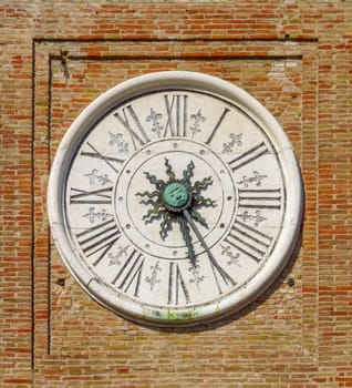 Ancient astronomical clock on the square Piazza tre Martiri in Rimini, Italy