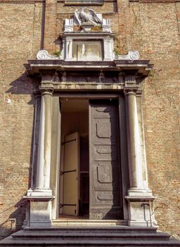 Door of old building in Rimini, Italy