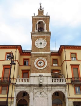 Ancient clock tower on the square Piazza tre Martiri in Rimini, Italy