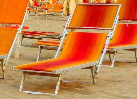 Orange sunbed on the beach in Rimini