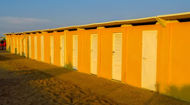 Yellow beach cabins in Rimini, Emilia-Romagna, Italy