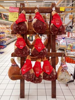 Rimini, Italy - June 22, 2017: Wooden Stand with Jamon in store.