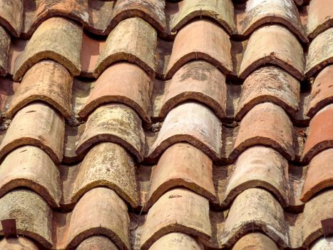 Closeup of old tile roof background in Italy