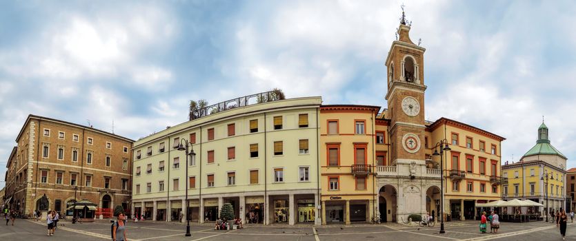 Rimini, Italy - June 14, 2017: The square Piazza tre Martiri with the ancient clock tower in Rimini, Italy