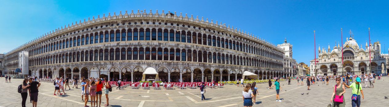 Venice, Italy - June 20, 2017: Panoramic view of a San Marco square in Venice, Italy. Thousands of tourists every month visit St Mark's Square.