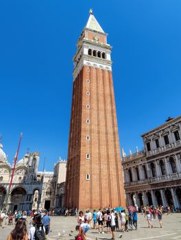 Venice, Italy - June 20, 2017: View of St Mark's Campanile in Venice, Italy. Thousands of tourists every month visit St Mark's Square.