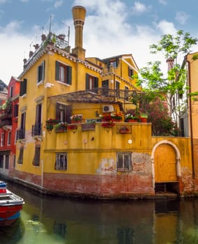 Venice, Italy - June 20, 2017: View from water canal to old buildings in Venice, Italy