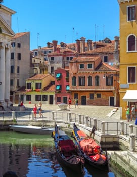 Venice, Italy - June 20, 2017: View from water canal to old buildings in Venice, Italy