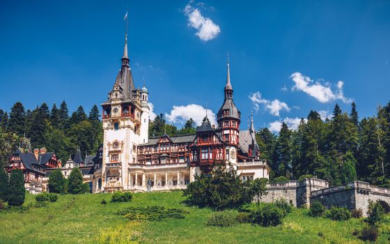 Peles Castle, Romania. Beautiful famous royal castle and ornamental garden in Sinaia landmark of Carpathian Mountains in Europe