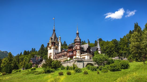 Peles Castle, Romania. Beautiful famous royal castle and ornamental garden in Sinaia landmark of Carpathian Mountains in Europe
