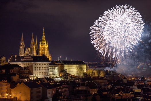 Fireworks over the Old Town of Prague, Czech Republic. New Year fireworks in Prague, Czechia. Prague fireworks during New Year Celebration near St. Vitus Cathedral, Prague, Czech republic.