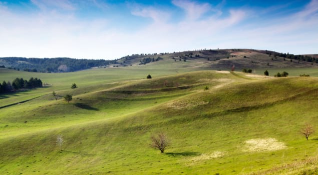 Beautiful summer landscape with green hills and blue sky.