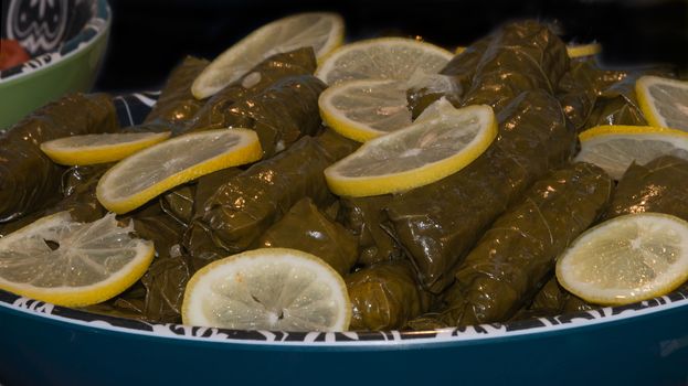 Dolmas - stuffed vine leaves for sale on a market