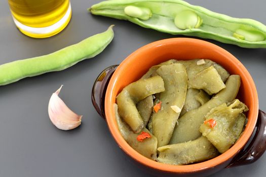 Cooked broad bean pods