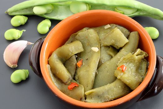 Cooked broad bean pods