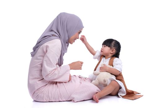 happy muslim mother and her daughter