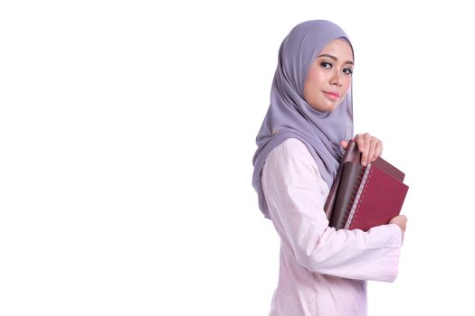 Muslim student woman bring education stuff on white background
