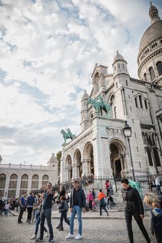 Paris, France - October 6, 2018: street atmosphere in front of the Sacre Coeur where people are walking and visiting Paris on a summer day