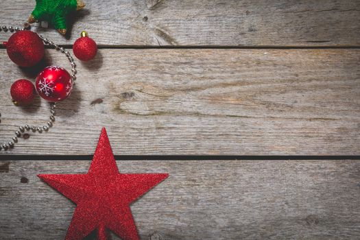 merry christmas concept with red decoration on old wooden board