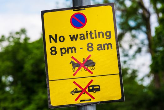 Road sign No stopping, no waiting, sign on metal pole