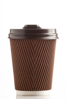 Paper brown corrugated cup on a white background with a lid. A glass for hot drinks. Takeaway drinks