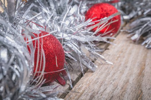 merry christmas concept with grey decoration on old wooden board