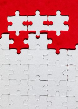 Closeup of jigsaw puzzle isolated. Missing jigsaw puzzle piece, business concept for completing the puzzle piece. Group of puzzle and a puzzle piece. Teamwork concept. Think difference concept. 