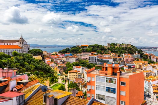 Lisbon, Portugal skyline with Sao Jorge Castle. Panoramic aerial view of Lisbon, Portugal. Panorama view of old town Lisbon and Sao Jorge Castle, the capital and the largest city of Portugal.
