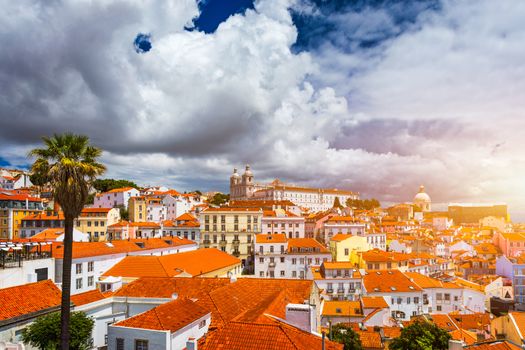 Lisbon, Portugal city skyline over the Alfama district. Summertime sunshine day cityscape in the Alfama, historic old district Alfama in Lisbon, Portugal. Lisbon cityscape in the Alfama District. 