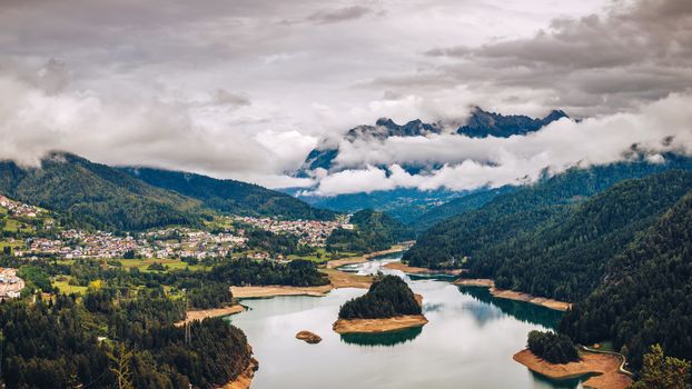 Panoramic view of lake of Centro Cadore in the Alps in Italy, Dolomites, near Belluno.