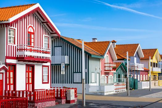 Street with colorful houses in Costa Nova, Aveiro, Portugal. Street with striped houses, Costa Nova, Aveiro, Portugal. Facades of colorful houses in Costa Nova, Aveiro, Portugal.
