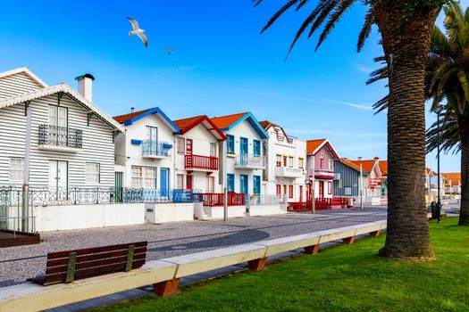 Street with colorful houses in Costa Nova, Aveiro, Portugal. Street with striped houses, Costa Nova, Aveiro, Portugal. Facades of colorful houses in Costa Nova, Aveiro, Portugal.