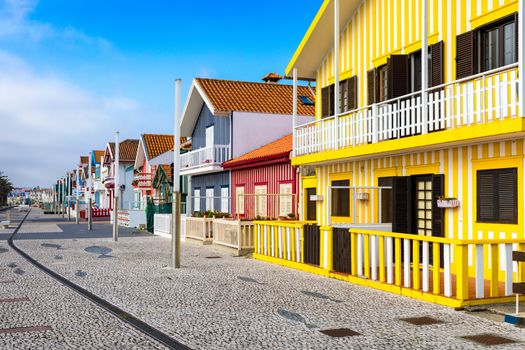 Street with colorful houses in Costa Nova, Aveiro, Portugal. Street with striped houses, Costa Nova, Aveiro, Portugal. Facades of colorful houses in Costa Nova, Aveiro, Portugal.