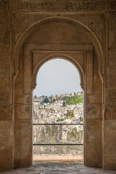 Nice arch door in ancient Arabian palace Alhambra. Granada, Spain.