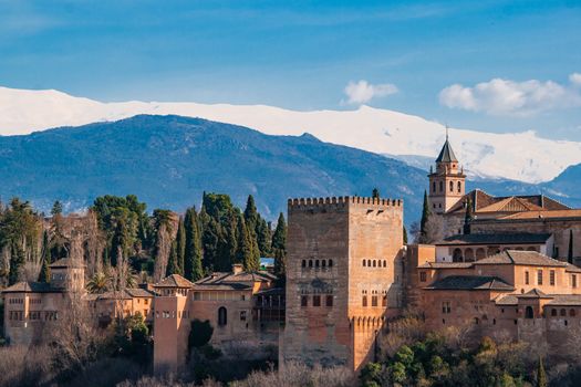 Ancient arabic fortress Alhambra at the beautiful evening time, Granada, Spain, European travel landmark