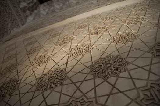 Arabic geometrical decoration on plaster. Closeup view