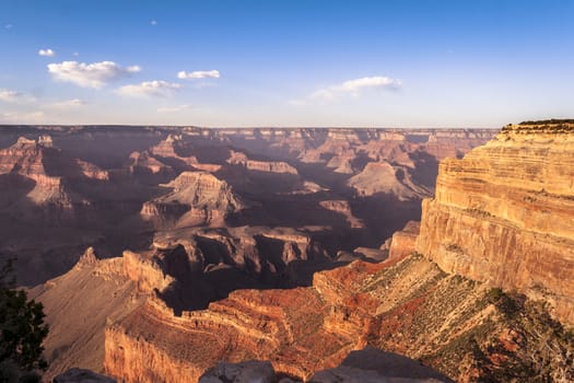 a man looking at the edge on the Grand Canyon, western USA