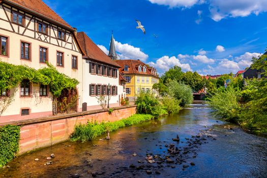Old city of Ettlingen in Germany with a river and a church. View of a central district of Ettlingen, Germany, with a river and a bell tower of a church. Ettlingen, Baden Wurttemberg, Germany.