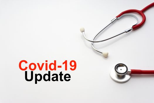 COVID-19 UPDATE text with stethoscope on white background. Covid or Coronavirus Concept 