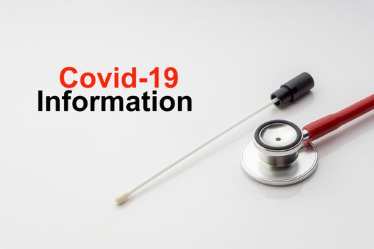 COVID-19 INFORMATION text with medical swab on white background. Covid or Coronavirus Concept 