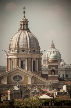 view of San Carlo al Corso and Chiesa di San Rocco all'Augusteo from Piazza Spagna in Rome Italy.
