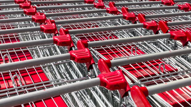 Row of red shopping cart at departmentstore