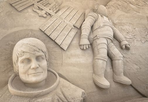 Sand sculpture depicting the first moon landing.