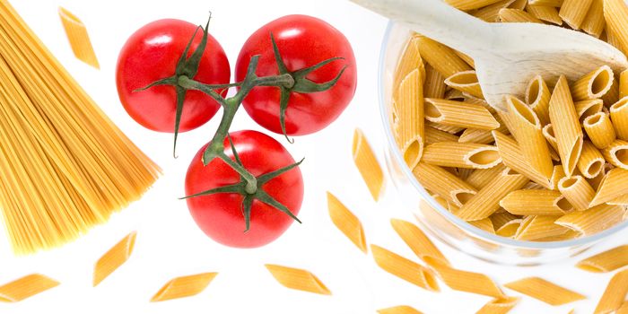 Beautiful tasty composition of traditional italian pasta with tomatoes. Top view. Abstract. Food concept.
