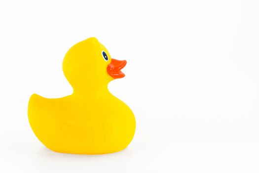 Cute yellow rubber duck isolated over white background