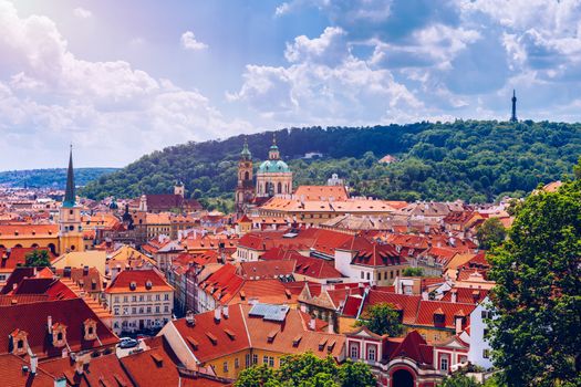 Top view to red roofs skyline of Prague city, Czech Republic. Aerial view of Prague city with terracotta roof tiles, Prague, Czechia. Old Town architecture with terracotta roofs in Prague.