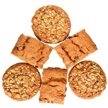 Round cereal biscuits with sunflower seeds, cunate, flax and oat flakes isolated on white background.