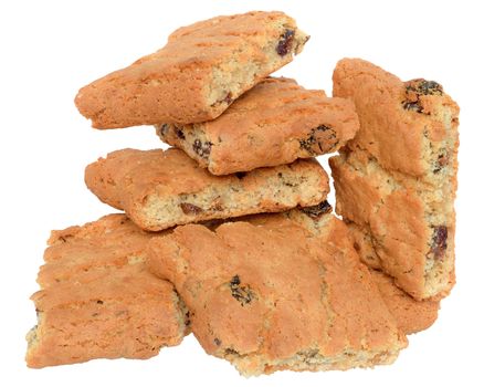 Appetizing chip cookies with raisins and candied fruit close-up tower isolated on white background. 